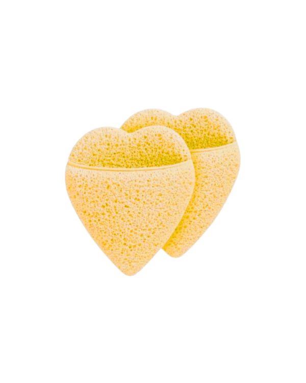Esponja de limpeza facial em formato de coração, ideal para esfoliação suave e skincare diário.